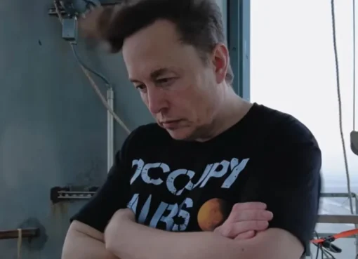 Dramatic close-up photo of Elon Musk from the documentary trailer.
