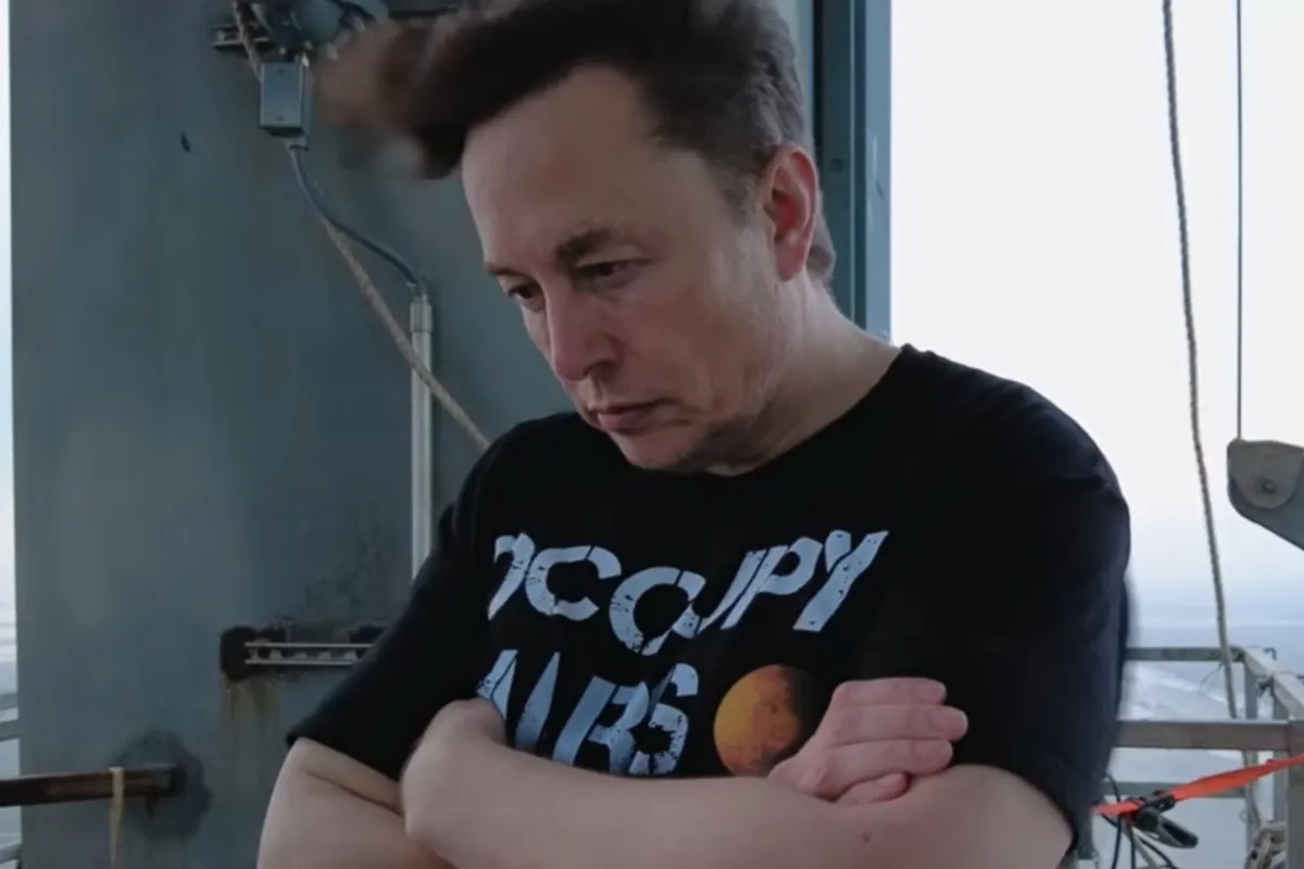 Dramatic close-up photo of Elon Musk from the documentary trailer.