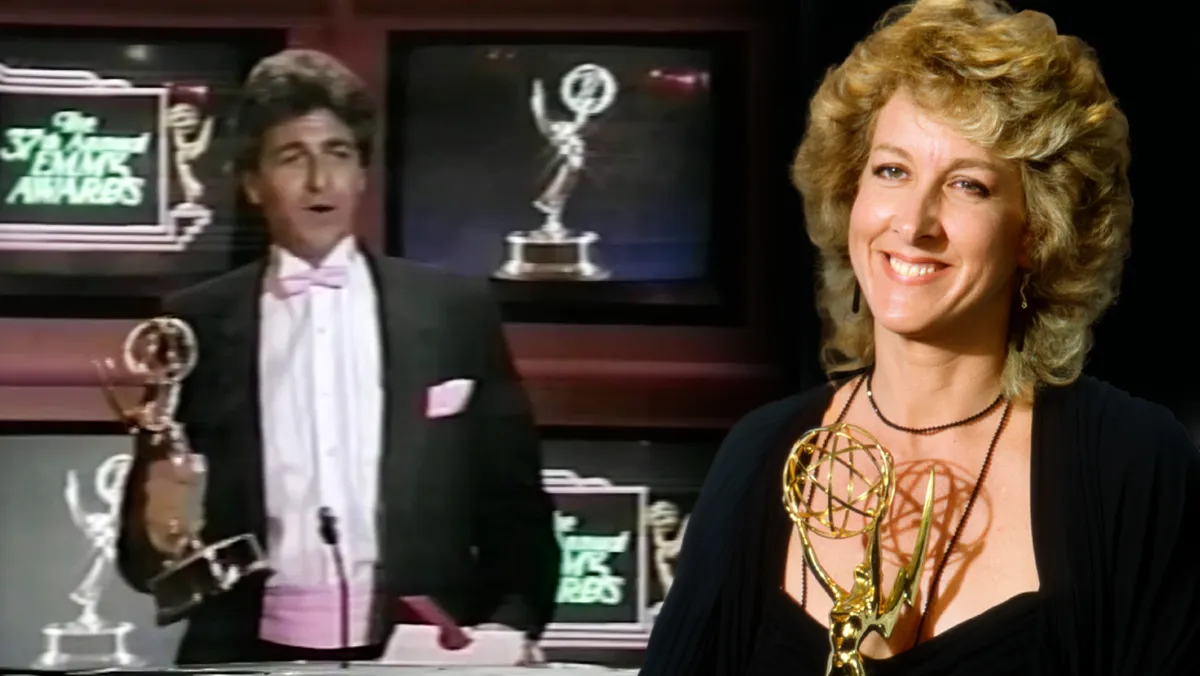 A photograph showing the grand stage and audience at the 1985 Emmy Awards, likely with John Forsythe hosting.