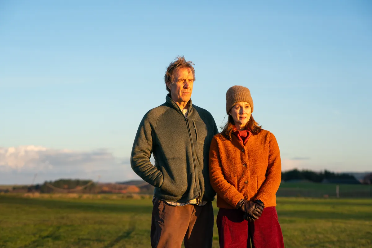 Laura Linney and Rhys Ifans in a gentle, compassionate movie scene.