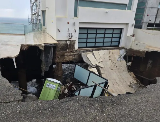 A large sinkhole has opened up under a beachfront home in Malibu.