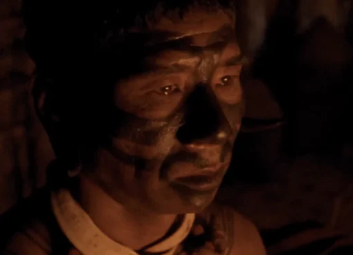A visually striking scene from the film 'Angh', showing characters in a lush, natural setting of Nagaland.