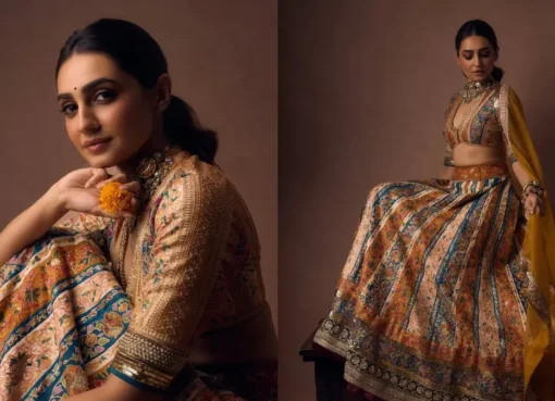 Vedika Pinto smiling, wearing a stunning colorful vintage lehenga at a festive event.