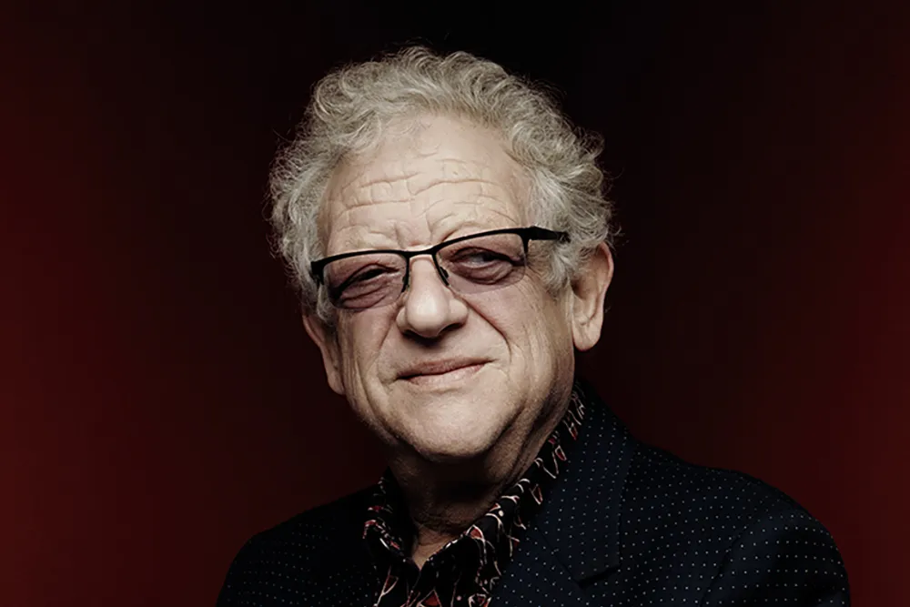 Portrait of British film producer Jeremy Thomas smiling gently.