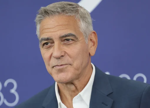 George Clooney, looking thoughtful, at a film festival or press event.