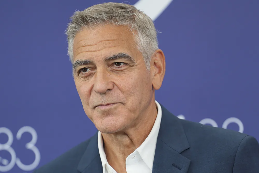 George Clooney, looking thoughtful, at a film festival or press event.