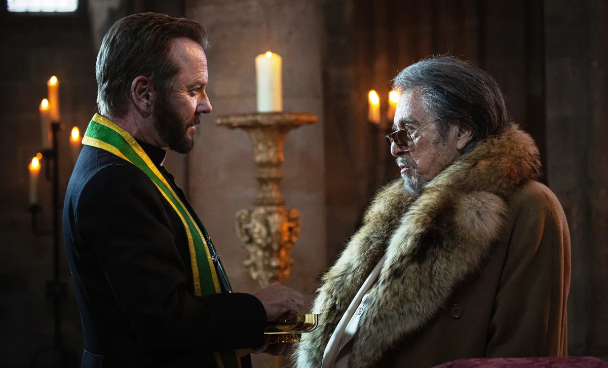 Kiefer Sutherland in character as a priest.