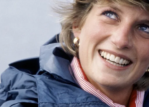 Princess Diana smiling and looking thoughtful.