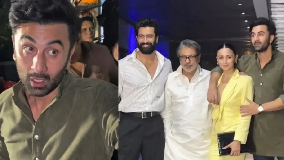 Ranbir Kapoor looking serious while escorting Alia Bhatt past flashing cameras.