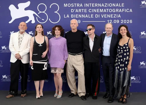 John Malkovich and Martin McDonagh smiling at the Venice Film Festival press conference.