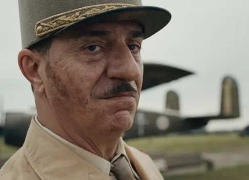 A serious-looking Charles de Gaulle in a military uniform, from the film 'De Gaulle'.
