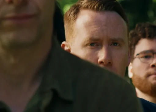 A young man, Danny Carlton, looking unsure and hesitant, portraying an aspiring life coach.