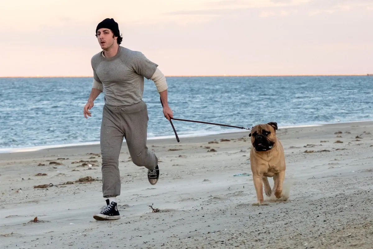 A movie poster for 'I Play Rocky' showing a young actor portraying Sylvester Stallone as Rocky Balboa, with a determined expression.