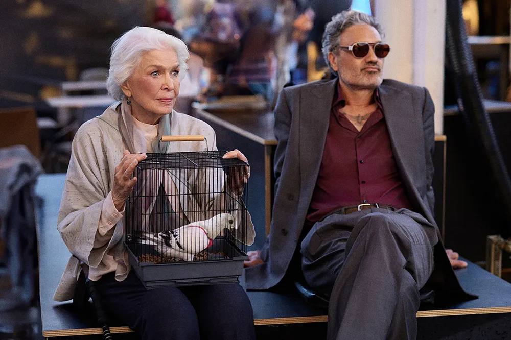 Kornél Mundruczó, Ellen Burstyn, and Taika Waititi looking surprised next to a pigeon.