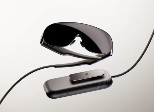 Person wearing sleek VR glasses, looking amazed.