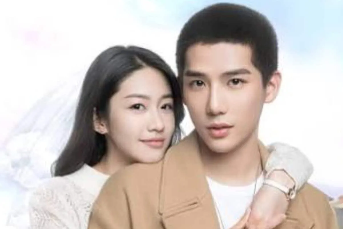 A cozy setup with a laptop showing a romantic scene from a Chinese drama