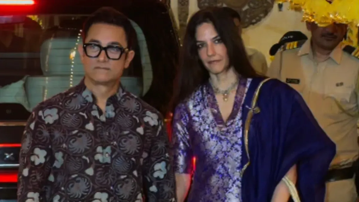 Aamir Khan and Gauri Spratt arriving hand-in-hand at a Karwa Chauth celebration.