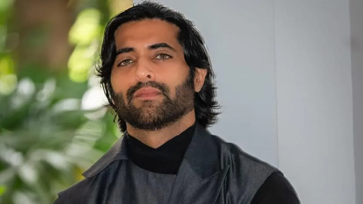 Actor Akshay Oberoi smiling.