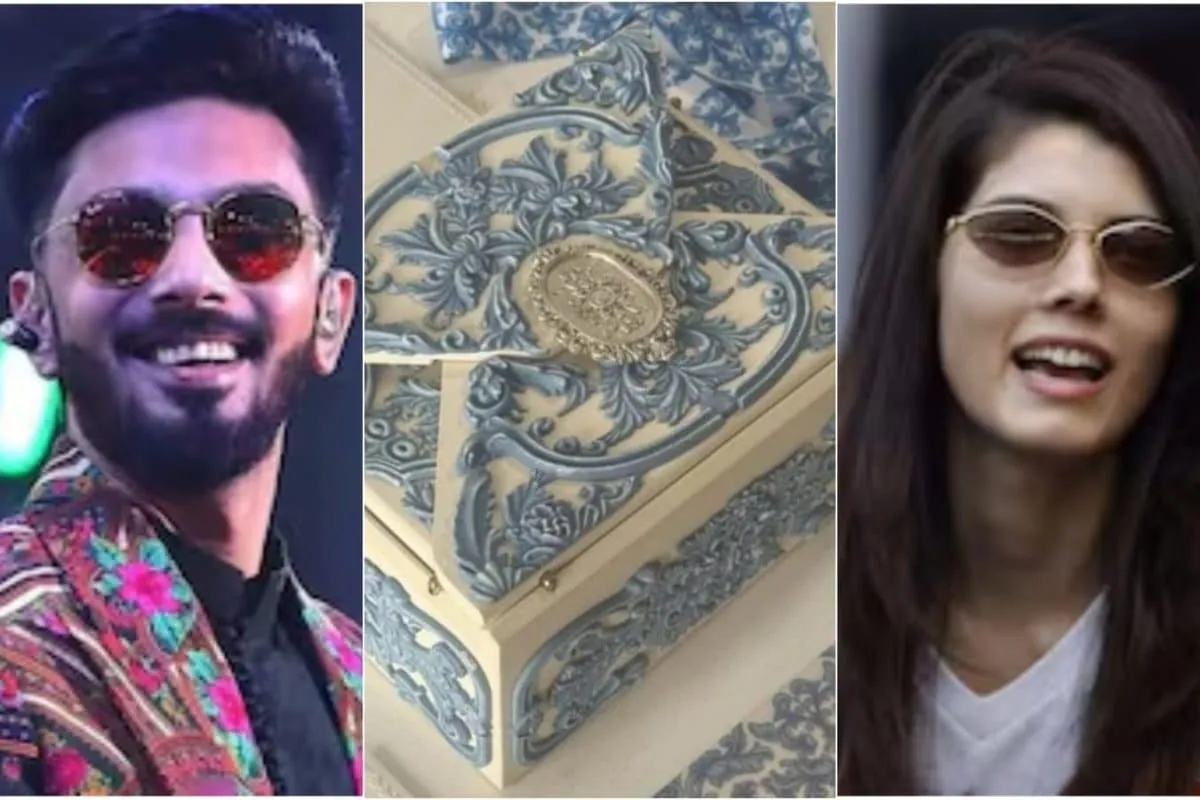 Anirudh Ravichander and Kavya Maran's elegant, vintage-inspired wedding reception invitation card.
