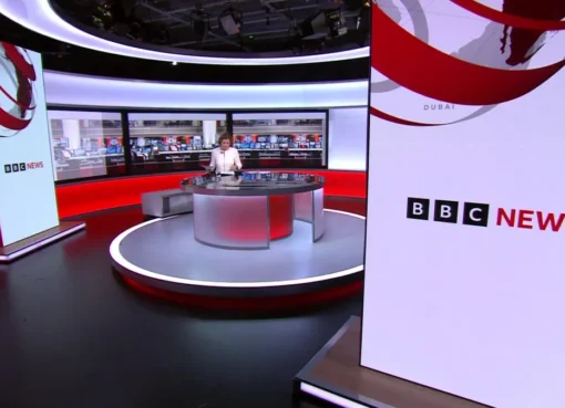 Four silhouettes standing in front of a BBC news logo, symbolizing the final candidates for the news chief role.