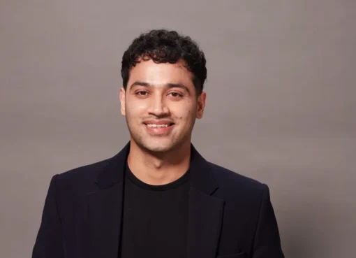 Raj Shamani smiling during a podcast recording