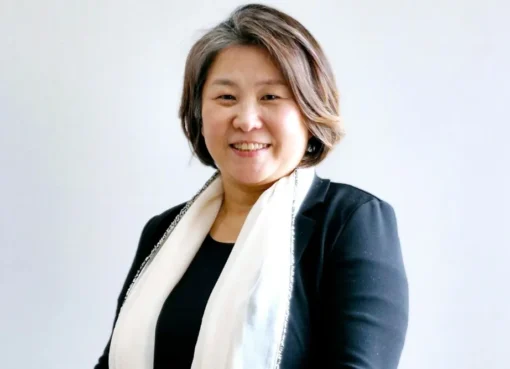 Portrait of Ellen Y.D. Kim smiling and looking thoughtful.
