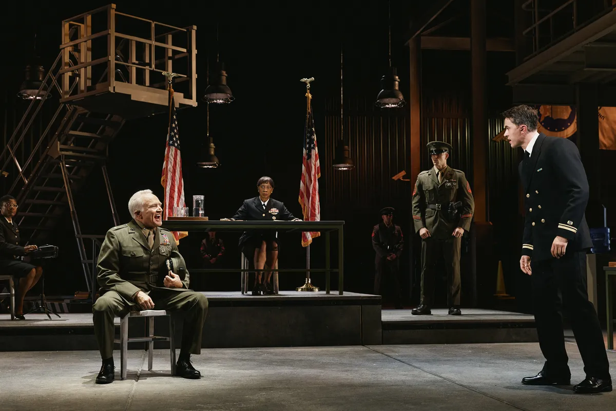 Bradley Whitford and Tom Blyth performing on a Broadway stage