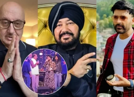 Daler Mehndi performing on stage, smiling, with a mic in hand.