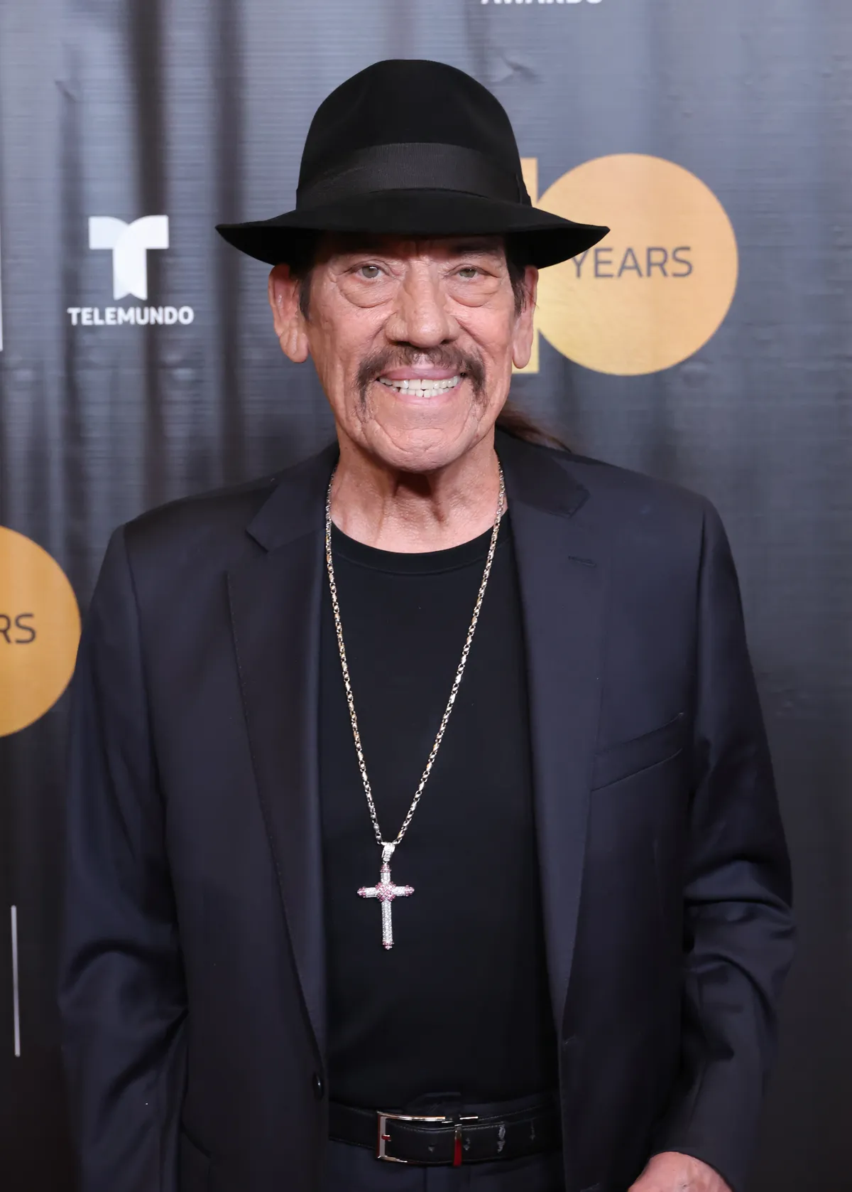 A close-up of Danny Trejo, known for his tough but kind demeanor, looking directly at the camera.