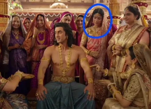 A still image from a song showing characters in traditional Indian attire, possibly during a haldi ceremony.