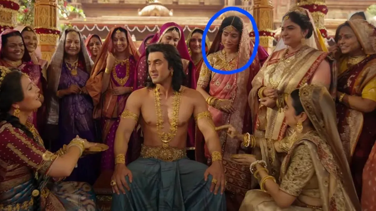 A still image from a song showing characters in traditional Indian attire, possibly during a haldi ceremony.