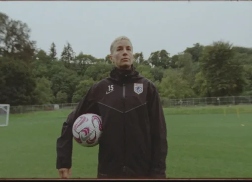 A film reel next to a soccer ball with a world map in the background, symbolizing international cinema and sports documentaries.