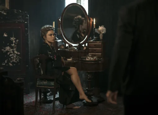 Florence Pugh in a period costume looking intense.