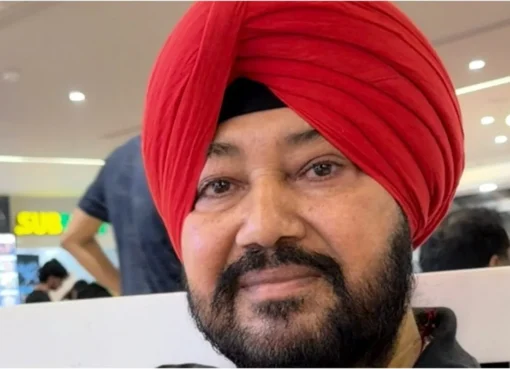 A photo of Daler Mehndi smiling happily.