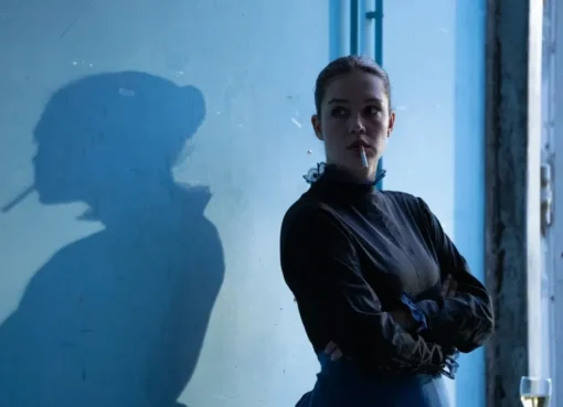 A classic scene from a French film, perhaps a director looking through a camera lens, with soft, artistic lighting.