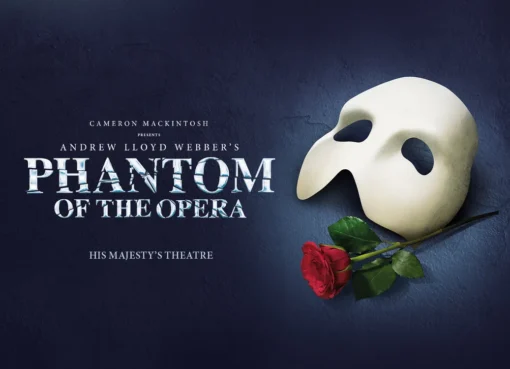 A masked Phantom in a dramatic, dimly lit scene, with a candelabra in the foreground.