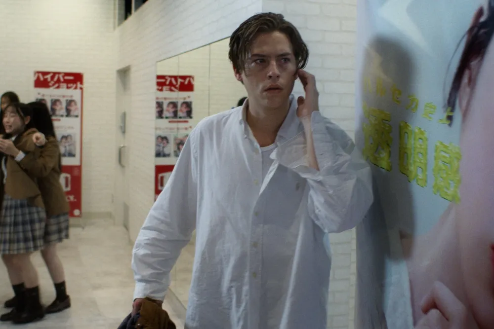 Actor Cole Sprouse looking intense in a scene from his movie 'Vintage Violence'.