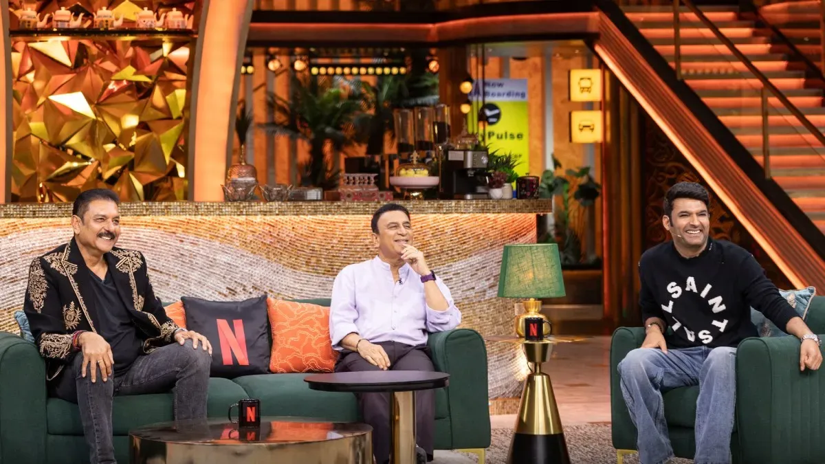 Kapil Sharma sharing a laugh with cricket legends Sunil Gavaskar and Ravi Shastri on the set of his show.
