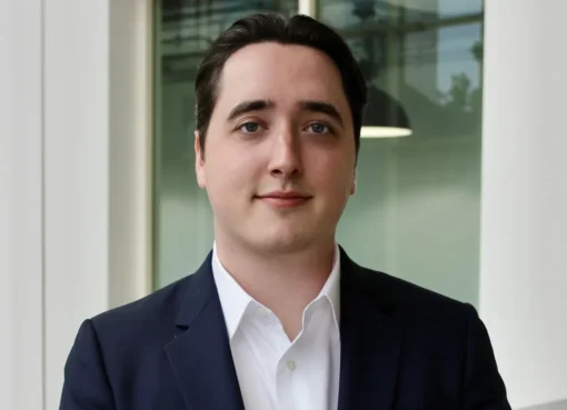 A professional shot of a talent agent in a modern office environment.