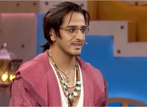 Qazi Touqeer inside the Bigg Boss house smiling.