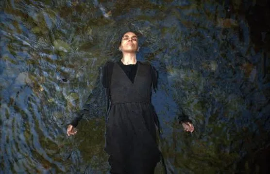 Promotional image for the horror film Motherwitch, featuring a mysterious, possibly cloaked figure.