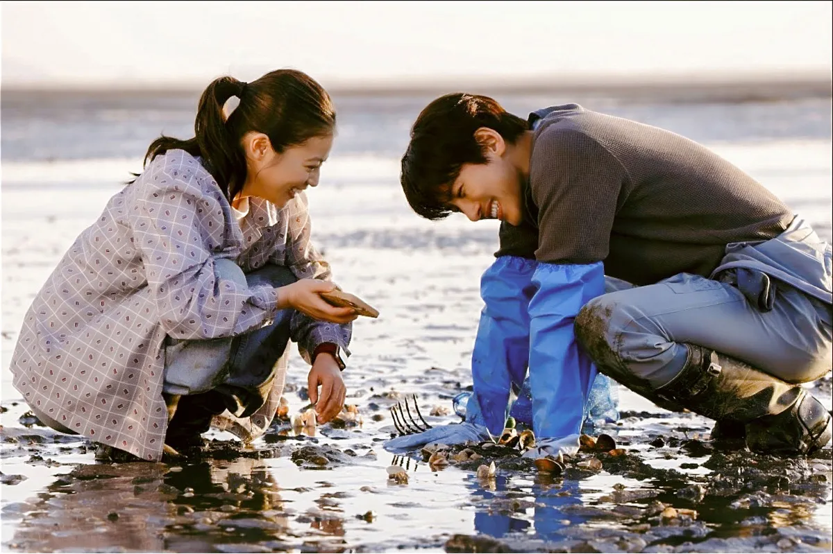 A colorful still from a modern drama series showing a cozy aesthetic