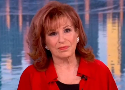 Joy Behar smiling on a TV show set.