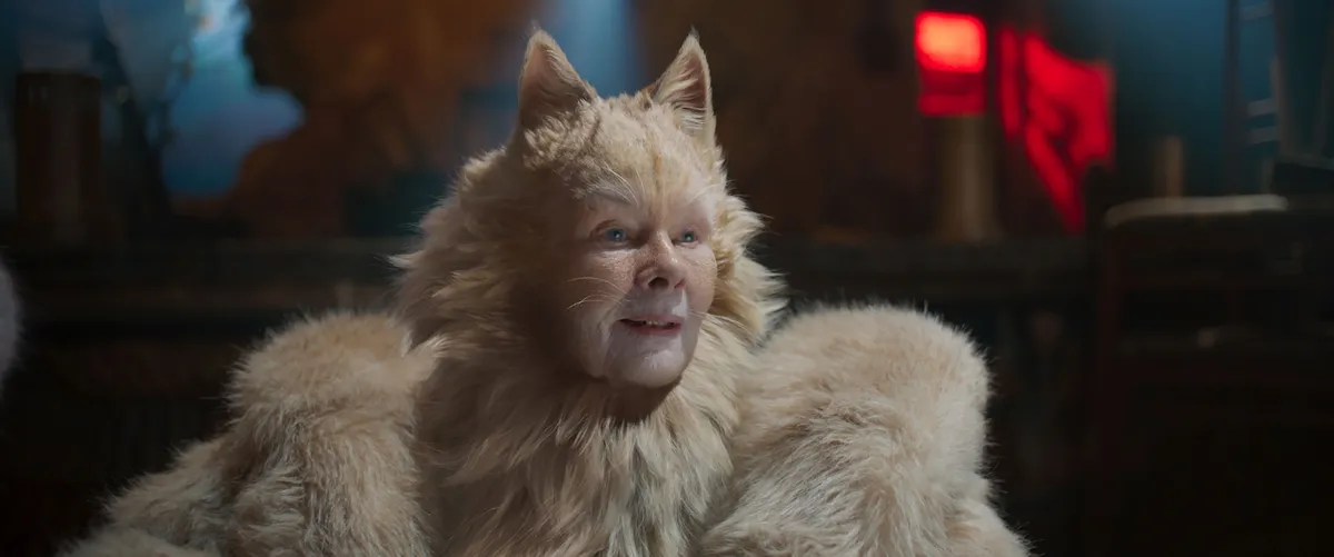 Judi Dench looking thoughtful during an interview.