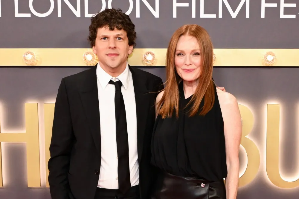 Julianne Moore and Jesse Eisenberg smiling together at the London Film Festival.