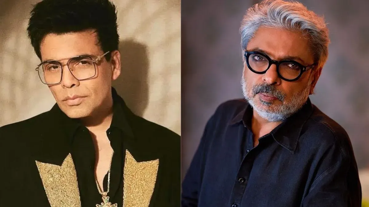 Karan Johar smiling on the Koffee With Karan set.