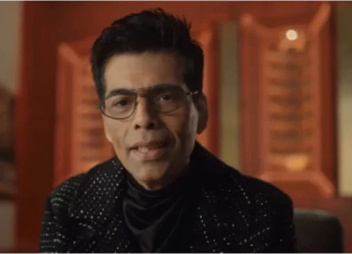 Karan Johar on a couch