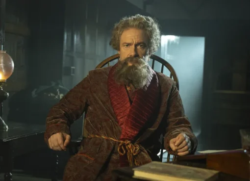 Martin Freeman and Jim Broadbent in a dimly lit, old-fashioned setting, hinting at a ghost story.