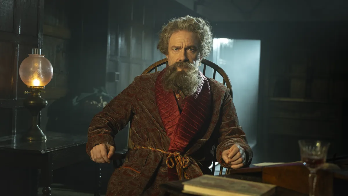 Martin Freeman and Jim Broadbent in a dimly lit, old-fashioned setting, hinting at a ghost story.