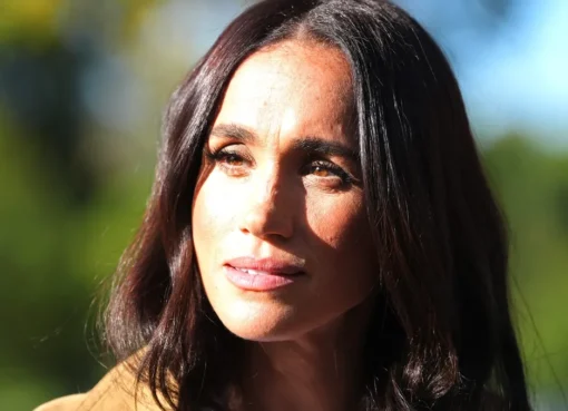 Meghan Markle looking pensive and thoughtful.